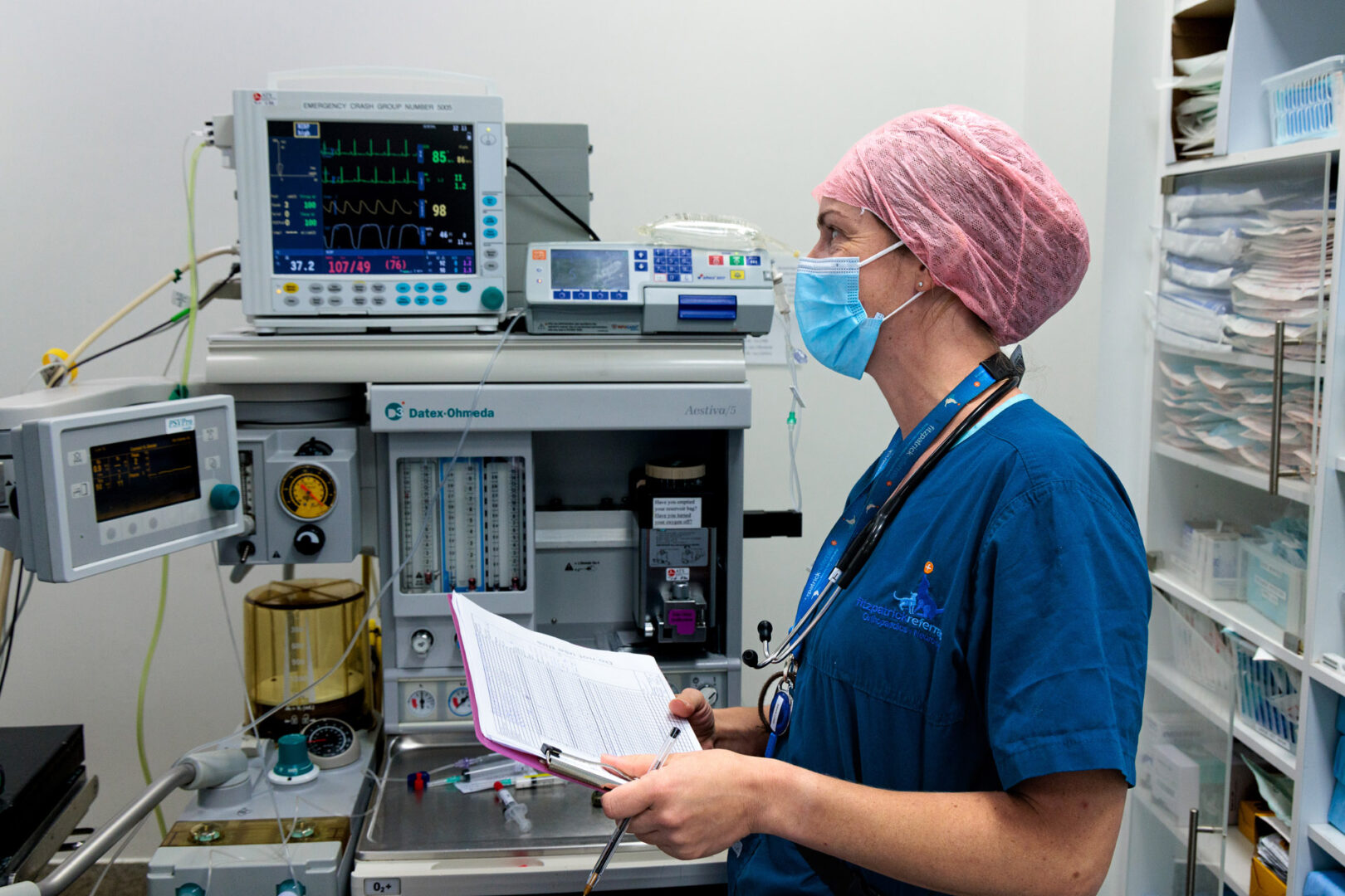 Prep Nurse monitoring a patient in theatre