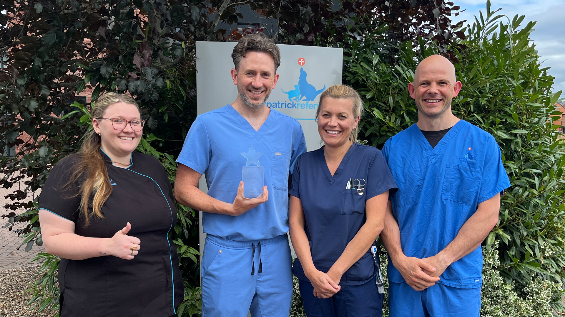 Fitzpatrick Referrals team members holding Best Referrals 2025 award outside the practice