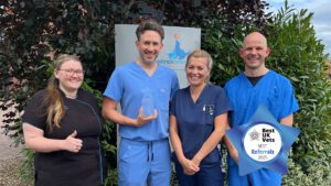 Fitzpatrick Referrals team members holding Best Referrals 2025 award outside the practice