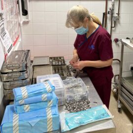 Surgical Technician preparing kits for surgery