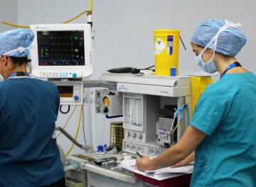Anaesthetist monitoring a patient in surgery